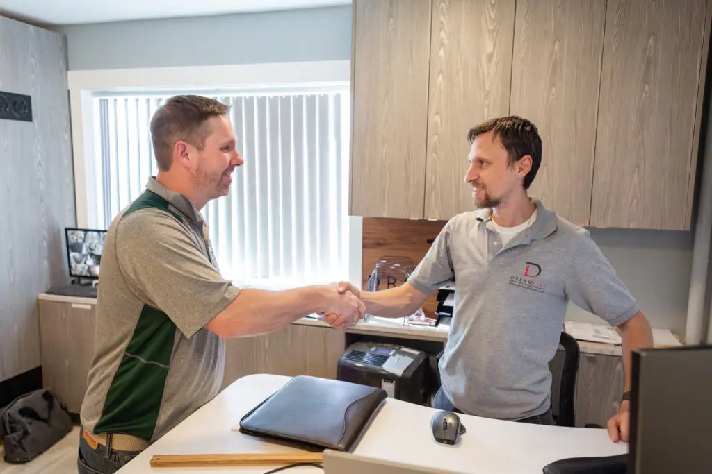 Tony Clark going over remodeling plans with a homeowner