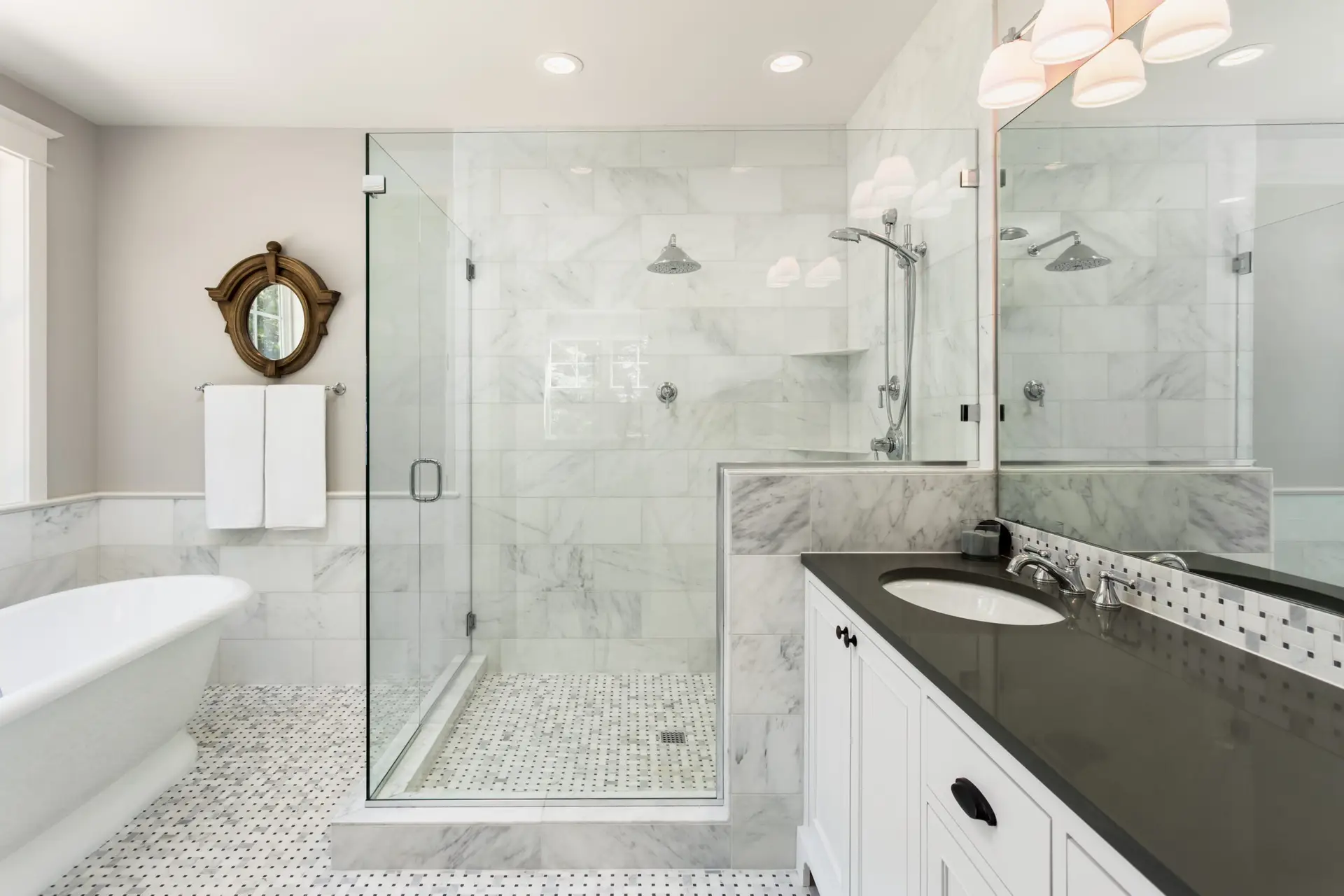 Small bathroom remodel ideas in action — walk-in shower with frameless glass in a compact bathroom